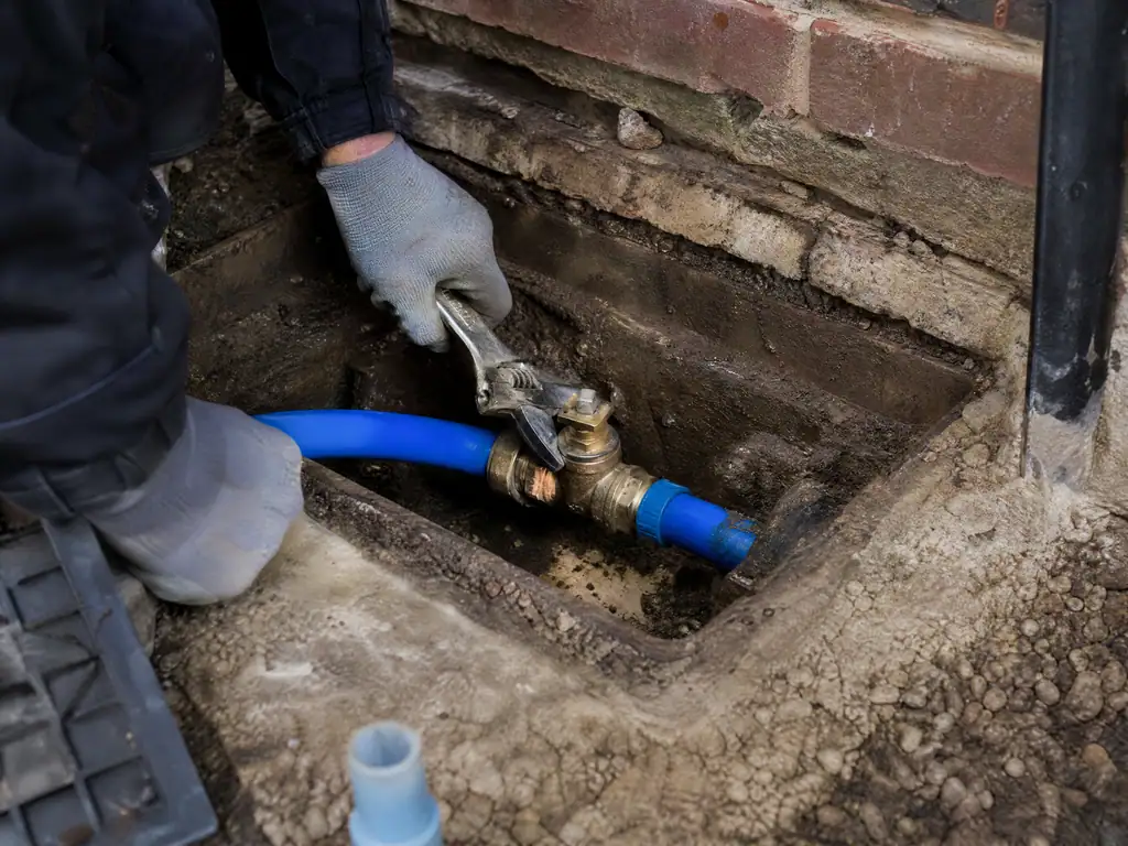 New supply pipe being connected at the boundary stop tap, Nottingham