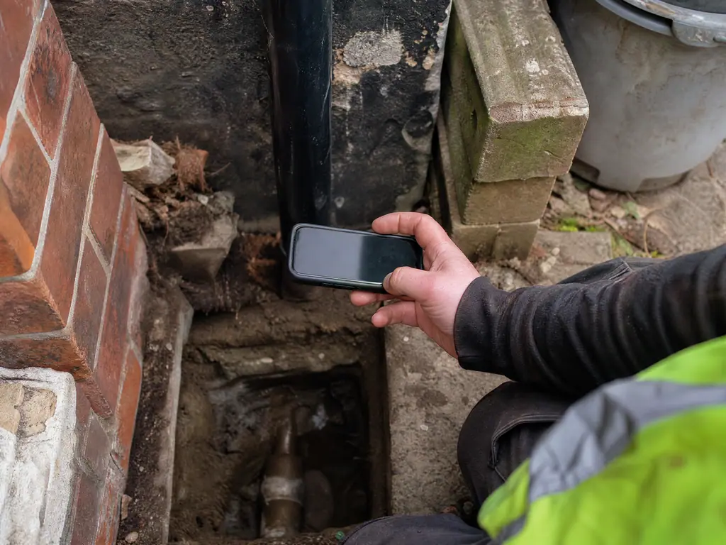 Photo record of a repaired supply pipe as proof for the water company, Nottingham