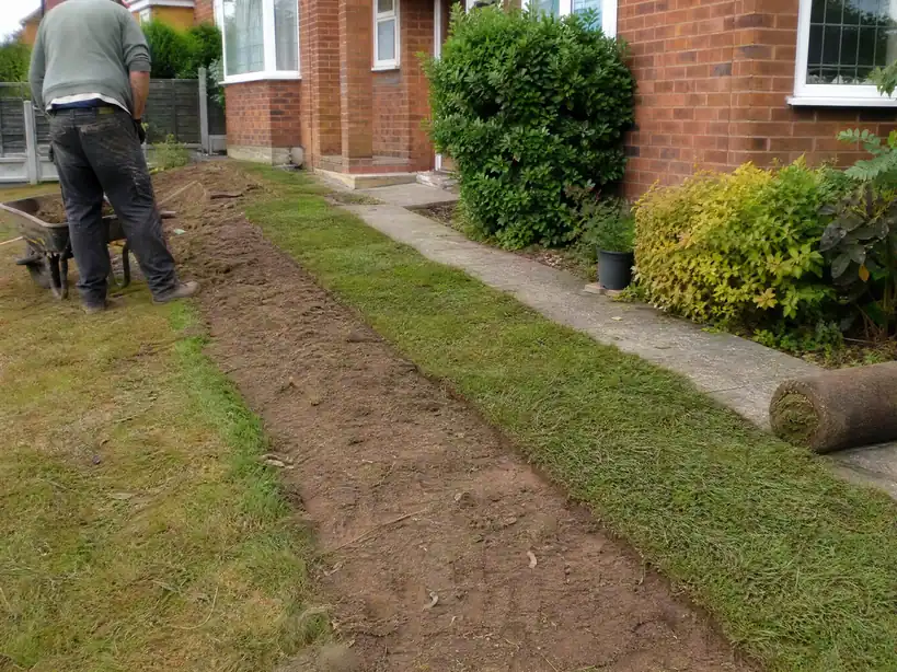 Front lawn neatly reinstated after a water supply pipe replacement, Nottingham